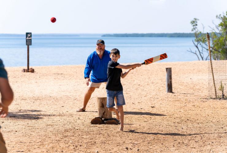 A group of people playing cricket on a beach at Crab Claw Island Resort, Bynoe, Northern Territory © Tourism Australia