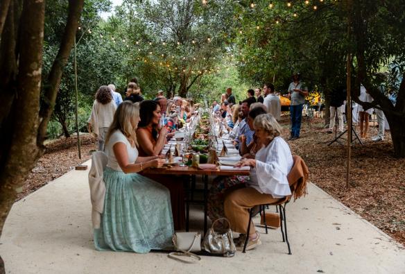 Guests enjoying a meal at a long table in the forest at Savour the Tweed, Tweed region, New South Wales © Savour the Tweed