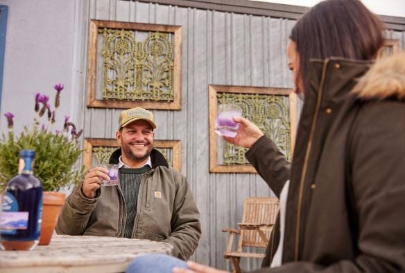 Couple having a drink in the outdoor dining area at Bathurst Grange Distillery, Bathurst, New South Wales © Destination NSW
