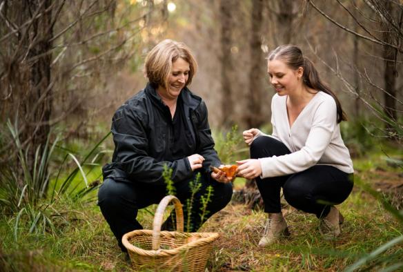 Women foraging for mushrooms in the forest, Experience Nature, Southern Highlands, New South Wales © Tourism Australia