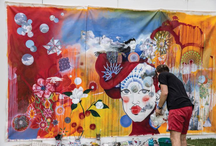 A person painting a colourful mural, Adelaide Fringe Festival, Adelaide, South Australia © Adelaide Fringe Festival 