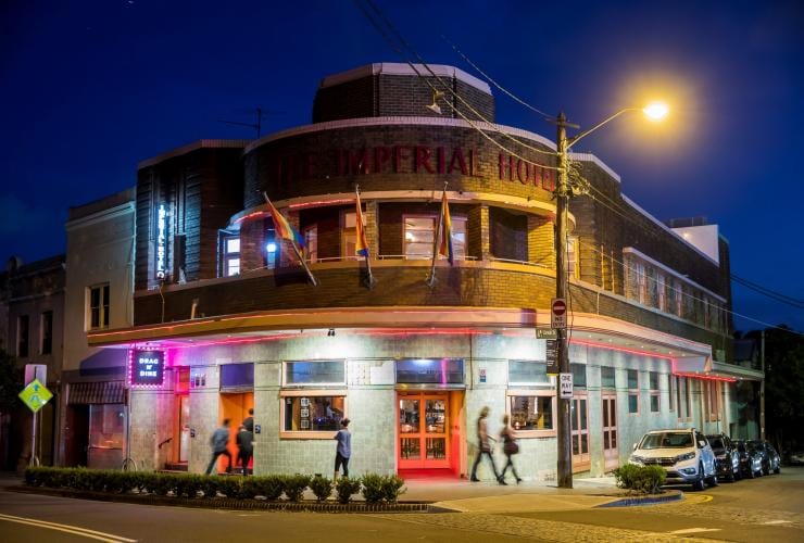 A hotel with pride flags on a street corner, The Imperial Hotel, Erskineville, Sydney, New South Wales © Destination NSW