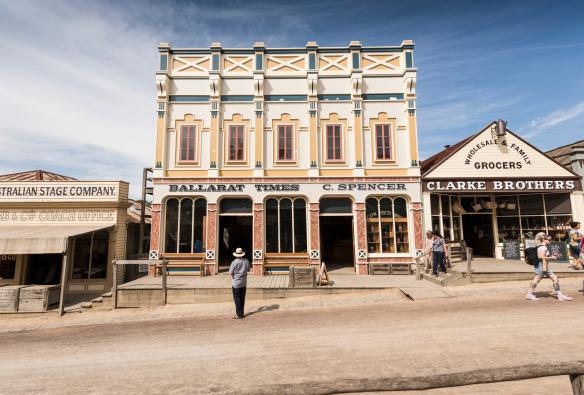 People wandering along a road lined with historic buildings in Sovereign Hill, Ballarat, Victoria © Visit Victoria