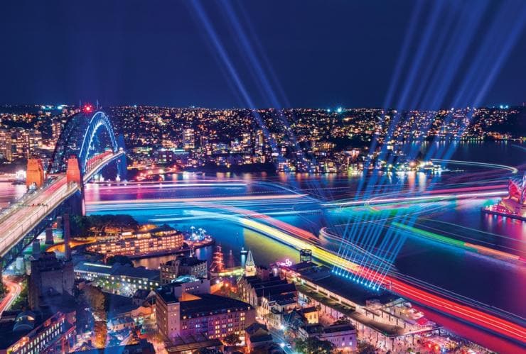 Sydney Habrour lit up in a rainbow of lights during Vivid Sydney, Sydney, New South Wales
