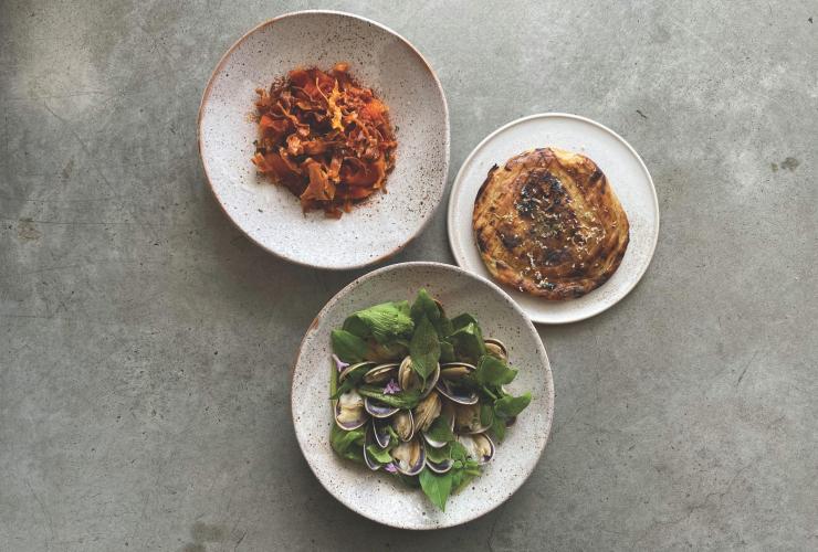 Three dishes consisting of bread, mussels and pasta, Pipit, Pottsville, New South Wales © Pipit Restaurant/Ben Devlin 