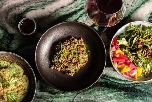 A table covered with vibrant vegetarian dishes, Monster Kitchen and Bar, Canberra, Australian Capital Territory © Ovolo Nishi