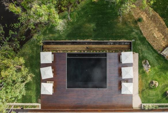 Aerial of the swimming pool and surrounding deck and greenery at Mt Mulligan Lodge, Mt Mulligan, Queensland © Tourism Australia