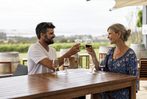 A man and woman drink wine, Frogmore Creek, Cambridge, Tasmania © Tourism Australia