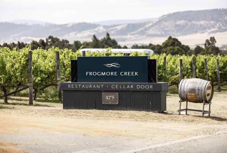 A winery sign in front of grapevines, Frogmore Creek, Cambridge, Tasmania © Tourism Australia