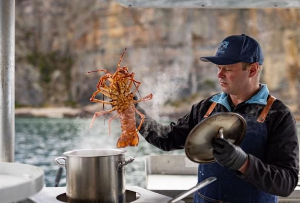 A man cooks lobster on a boat, Tasmanian Wild Seafood Adventures, Hobart, Tasmania © Dearna Bond