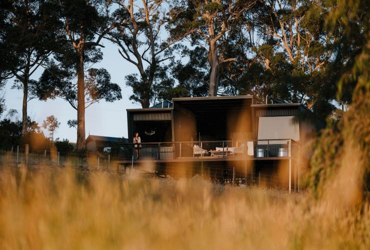 Woman standing on the balcony, Heyscapes Cabin, Denmark, Western Australia © Jarrad Seng