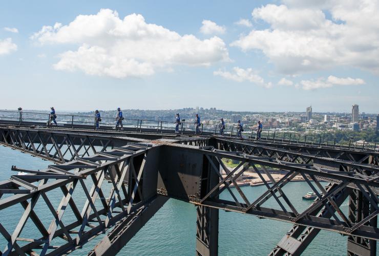 A group of people walking on top of a steel arch bridge during the Burrawa Climb, Sydney Harbour Bridge, Sydney, New South Wales © BridgeClimb