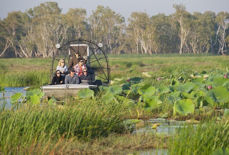 A group of people travelling on an airboat through lush wetlands with Lords Kakadu & Arnhem Land Safaris, Bamurru Plains, Northern Territory © Shaana McNaught