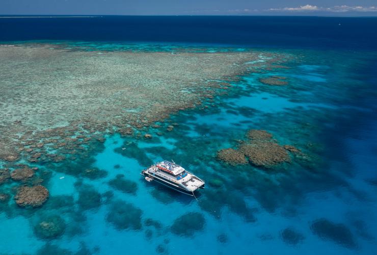 Aerial view of the Dreamtime Drive and Snorkel boat on the Great Barrier Reef near Cairns, Queensland © Tourism and Events Queensland
