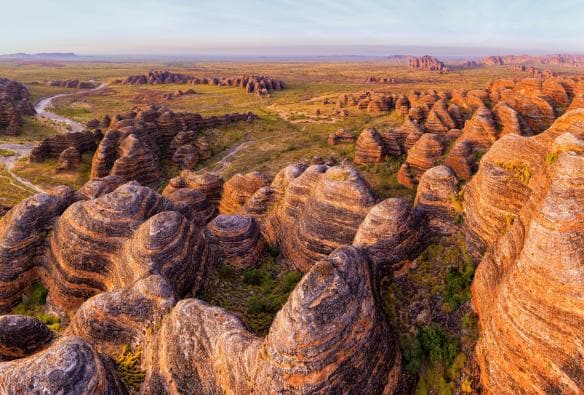 Aerial view of the black and orange striped rock domes of the Bungle Bungle Range, Purnululu National Park, Western Australia © Tourism Western Australia 