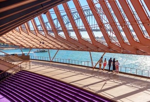 A diverse group of visitors immerse themselves in an architectural tour of the world-renowned Sydney Opera House, Sydney, New South Wales © Tourism Australia 