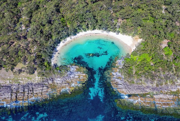 Aerial overlooking Honeymoon Bay, Jervis Bay, NSW © Jordan Robins