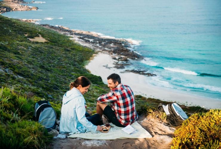 Walk into Luxury guests enjoying a gourmet lunch on the Cape to Cape track above Conto Spring Beach, WA © Tourism Western Australia and Walk Into Luxury 