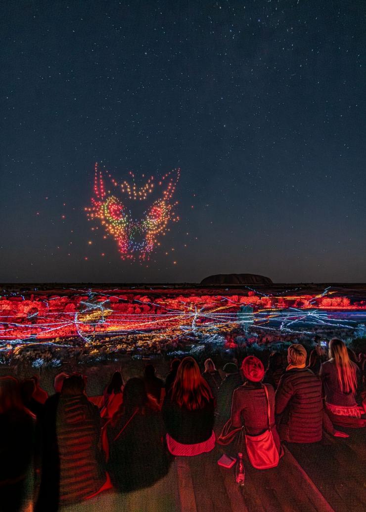 A ground watching the Wintjiri Wiru drone show with Uluru in the background, Uluru, Northern Territory © Tourism NT/Ray Reyes 