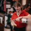 Bartender pouring spirits into glasses on a tasting paddle at the Hoochery Distillery Café in Kununurra, Western Australia © Tourism Western Australia