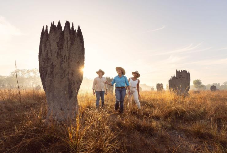 A farmer leads a couple among tall rock formations at Finniss River Lodge, Rakula, Northern Territory © Tourism Australia 