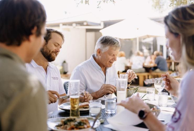 Group enjoying an al fresco meal at Olio Bello, Margaret River, Western Australia © Tourism Australia 