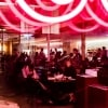 Bright neon lights and people fill out Supernormal, Melbourne © Trader House Restaurants, Nikki To
