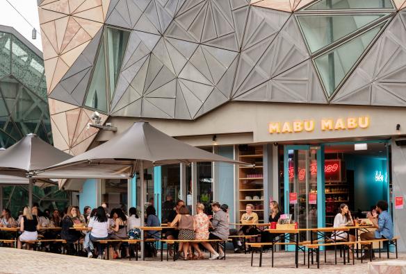 Outdoor tables and umbrellas at Big Esso by Mabu Mabu, Melbourne, Victoria © Visit Victoria 