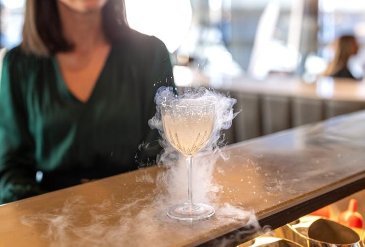 A smoking cocktail at Quay Restaurant, Sydney, New South Wales © Tourism Australia 