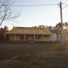  Exterior of a building with a yellow roof reading “Nindigully Pub”, Nindigully, Queensland © Tourism and Events Queensland