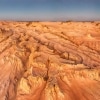 Aerial view over the rugged sand and clay formations of the Walls of China, Mungo National Park, New South Wales © Destination NSW