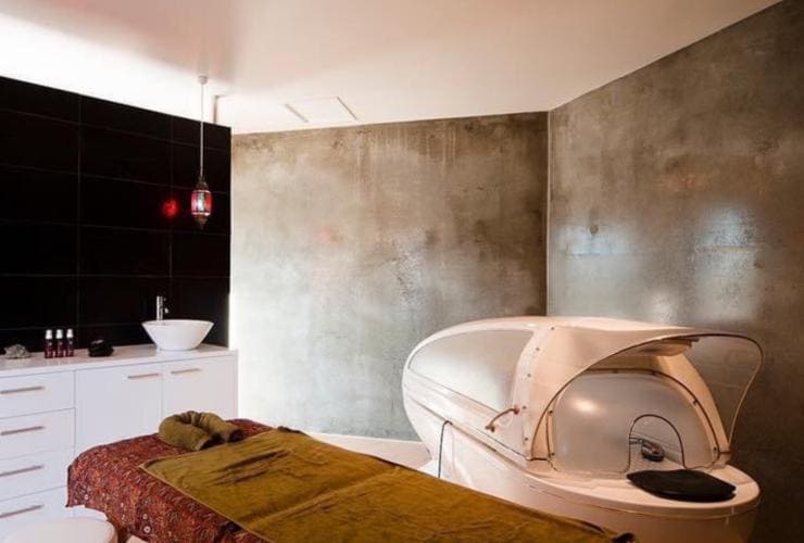 A massage room with a massage table and equipment at Harmony Hill Health Retreat, Hobart, Tasmania © Harmony Hill Health Retreat