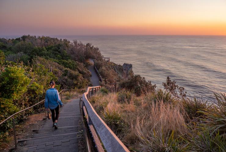 Woman on lighthouse walk at Cape Byron, Byron Bay, NSW © Tourism Australia