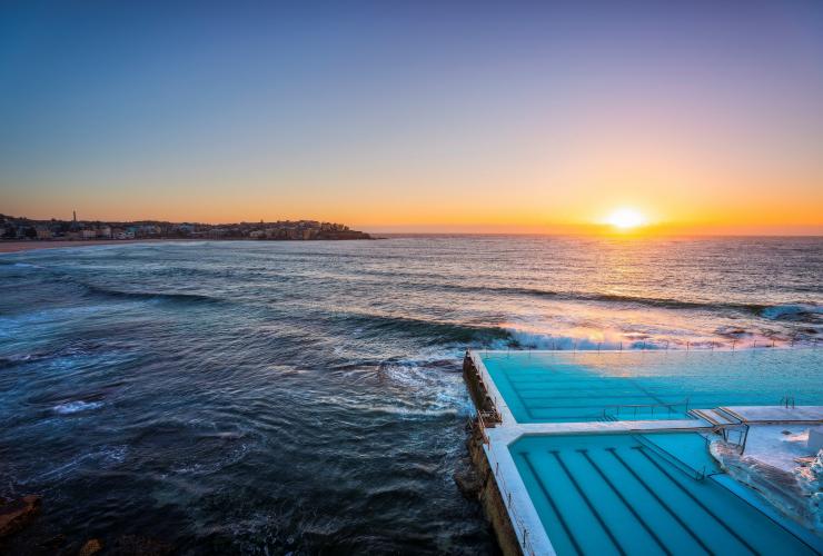 Morning sun rising over Bondi Icebergs, Bondi Beach, NSW © Destination NSW