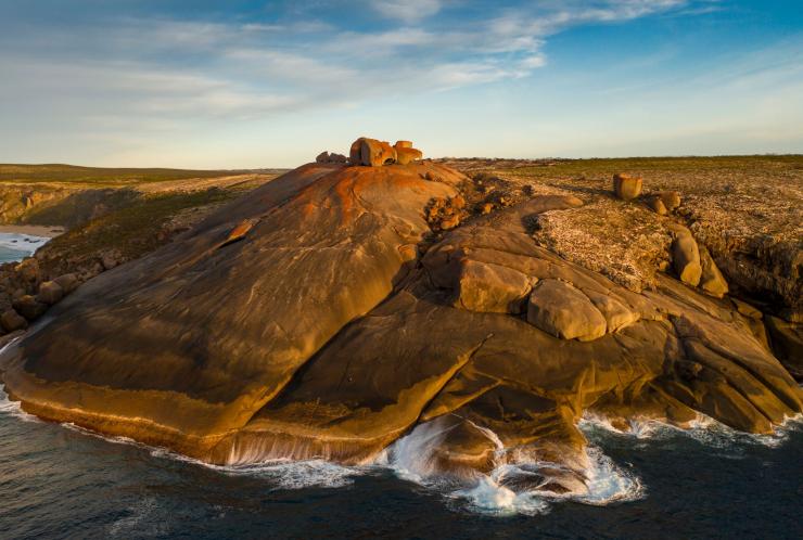 View from the ocean looking towards the Remarkable Rocks formations at the top of a cliff on the coastline of Kangaroo Island, South Australia © South Australian Tourism Commission