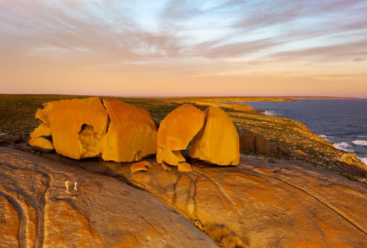 The sun glowing orange on the formations of the Remarkable Rocks beside the coastline of Kangaroo Island, South Australia © Tourism Australia