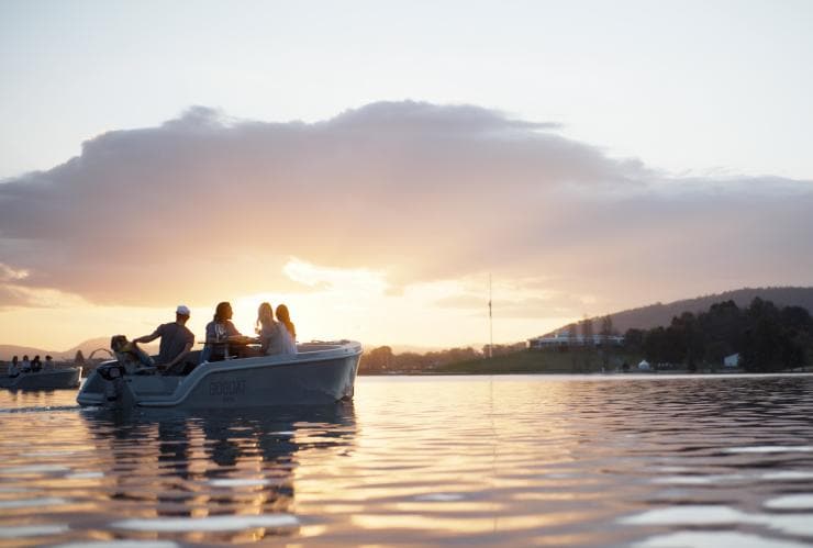 A group of friends riding a GoBoat on the flat water of Lake Burley Griffin, Canberra, Australian Capital Territory © Visit Canberra