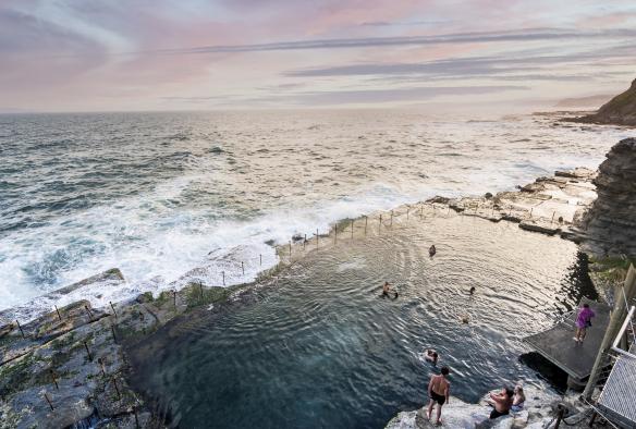 Swimmers enjoying swim in a rocky ocean pool at the Bogey Hole, Newcastle, New South Wales © Time Out