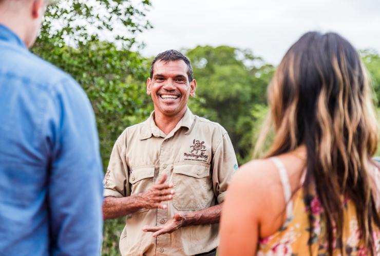 Couple listening to an Indigenous guide on a tour with Mandingalbay Authentic Indigenous Tours, Cairns, Queensland © Tourism and Events Queensland
