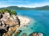 Aerial of a couple walking along a beach on a Salty Dog Adventure Tour in the Whitsundays, Queensland © Tourism and Events Queensland