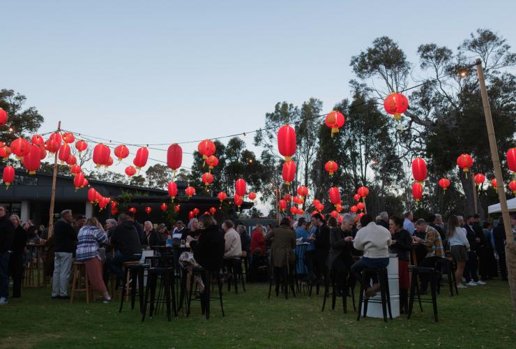 Lawn adorned with red lantern lights at Pair'd, Margaret River, Western Australia © Tourism Western Australia