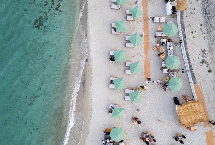 Aerial view of tables and umbrellas set up on the beach at Pair'd, Margaret River, Western Australia © Tourism Western Australia