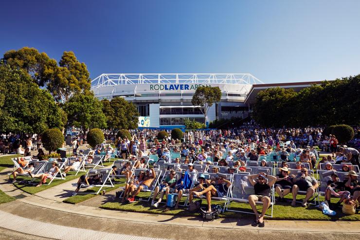 A group of people watching a tennis match from deckchairs at the Australian Open, Melbourne, Victoria © Tennis Australia