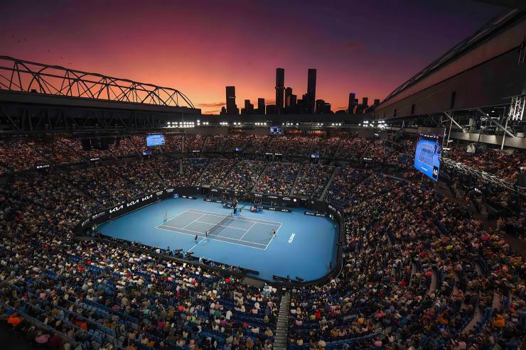A tennis court with the sunset behind it at the Australian Open, Melbourne, Victoria © Morgan Hancock