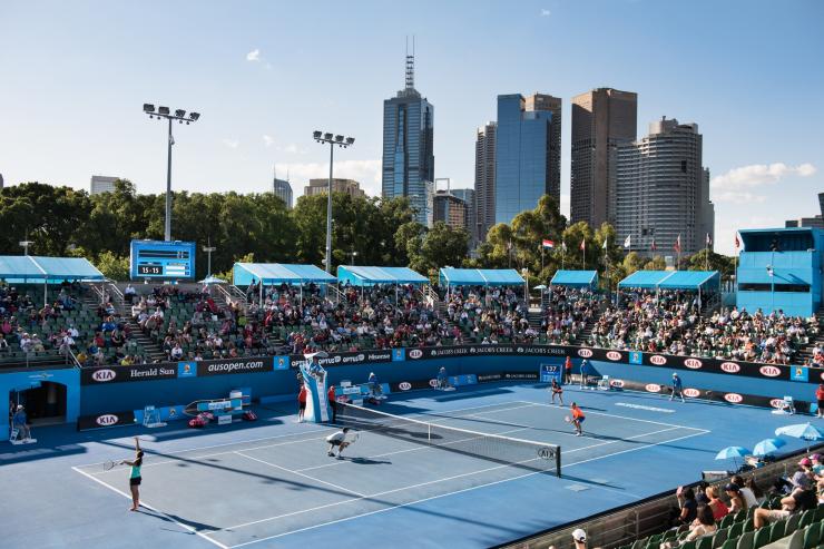 Outdoor tennis court with city skyline in the background at the Australian Open, Melbourne, Victoria © Visit Victoria