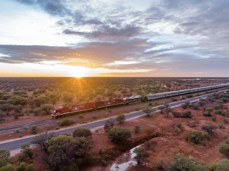 The Ghan passenger train rolling through the outback at Yorkey's Crossing, Port Augusta, South Australia © Tourism Australia 
